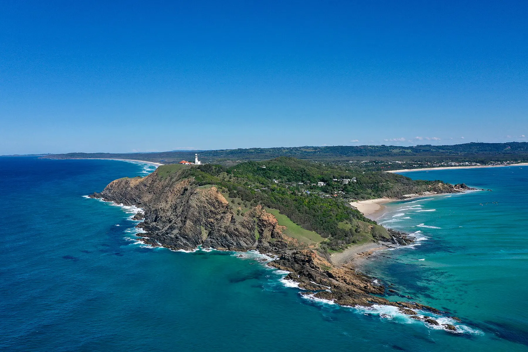 Aerial photograph of Cape Byron, the lighthouse, Tallow Beach and the hinterland