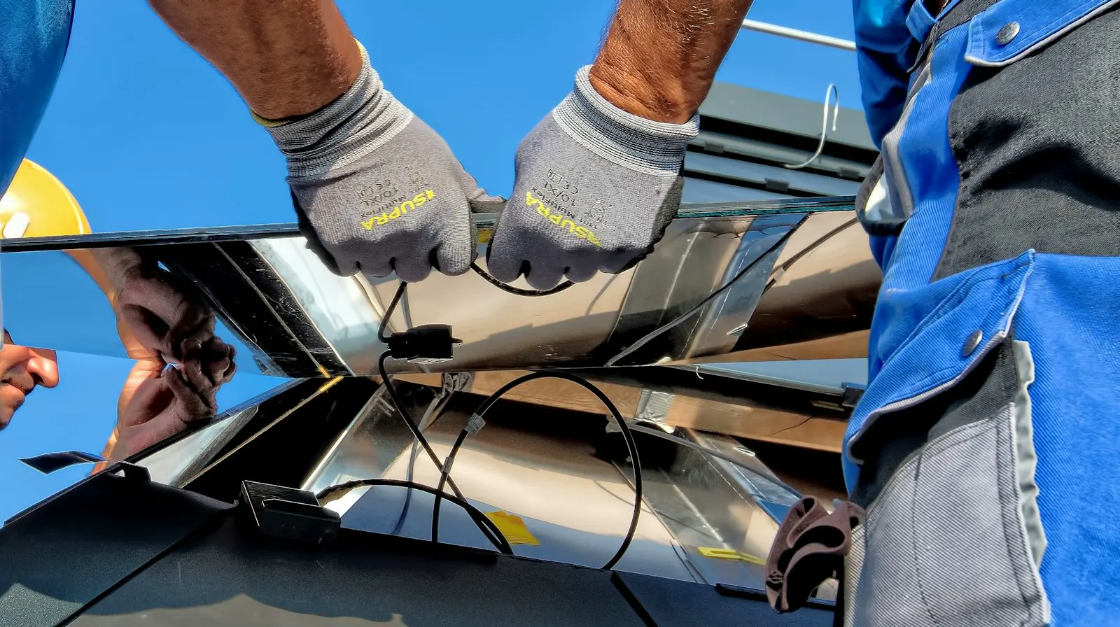 Hands on a solar module